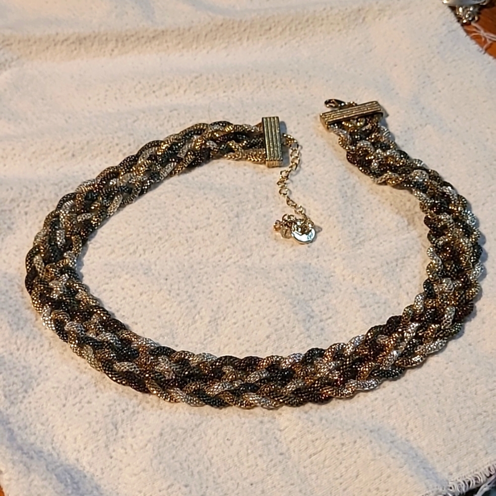 Necklace weaved silver and gold and bronze very sharp